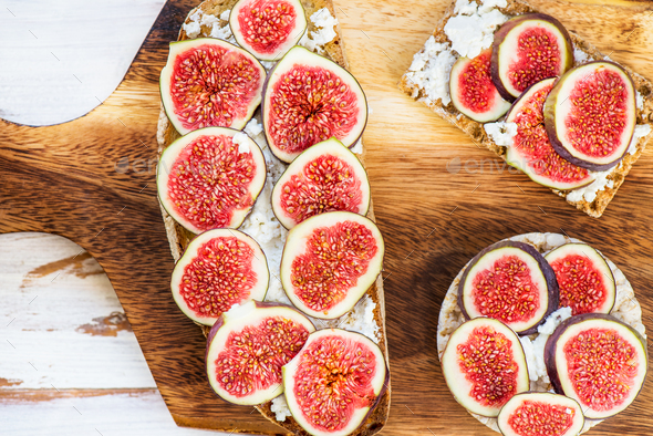 Healthy crackers and toast with figs and ricotta cheese - Stock Photo - Images