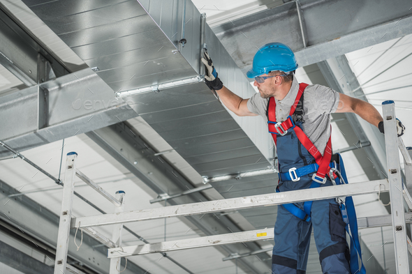 Professional Technician Worker Finishing Newly Assembled Air Vent Shaft - Stock Photo - Images