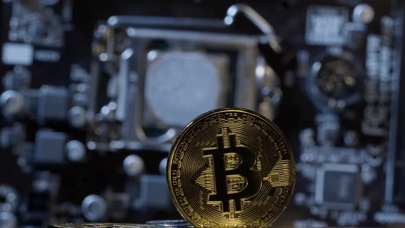 Bitcoin BTC Spinning on Computer Motherboard Background Cryptocurrency Mining Virtual Money alt