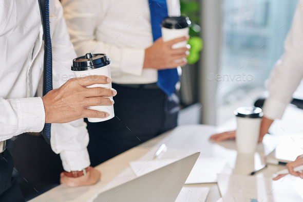 Entrepreneur drinking coffee at meeting