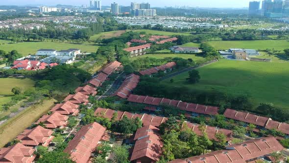 wide shots of condominiums and landed houses with trees and nature looks alt