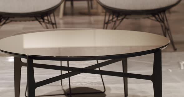 Modern Minimalist Round Table in Contemporary Interior in living room. alt