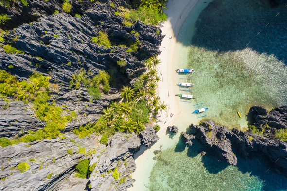 El Nido, Palawan, Philippines, top down bird eye aerial view of boats and cliffs rocky mountains