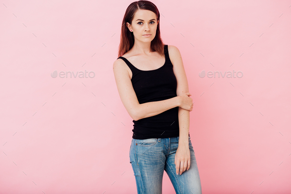 Woman casual style over pink background portrait