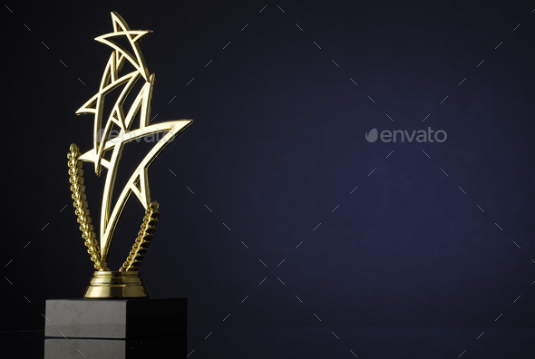 Stylish trophy with three gold stars and wreath - Stock Photo - Images