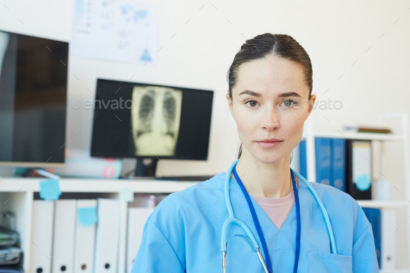 Portrait of Young Female Medic in Clinic - Stock Photo - Images