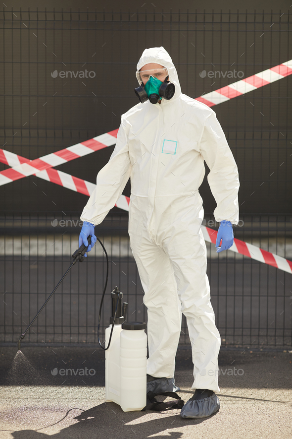 Disinfection Worker with Danger Tape - Stock Photo - Images