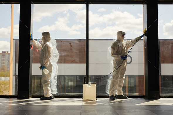 Workers doing Chemical Cleaning Indoors Stock Photo by seventyfourimages