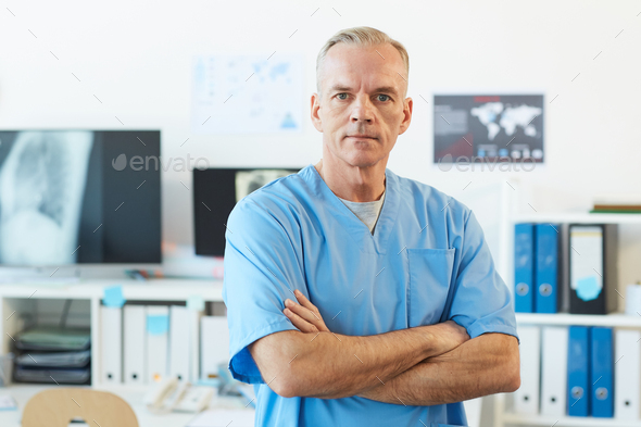 Portrait of Mature Male Medic in Clinic - Stock Photo - Images