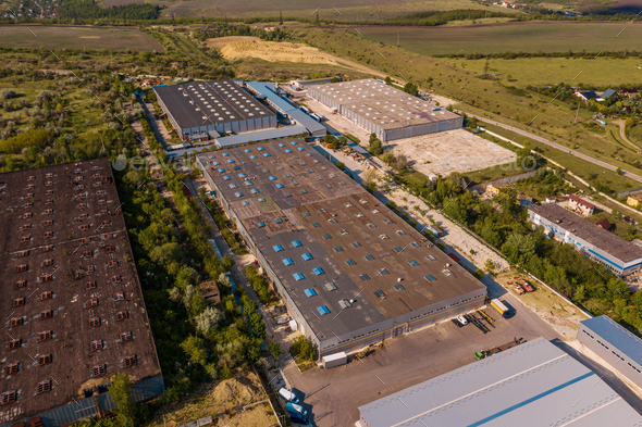 Top view industrial area warehouses in a green region - Stock Photo - Images