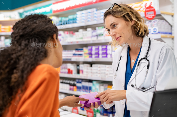 Pharmacist explains medicine properties - Stock Photo - Images