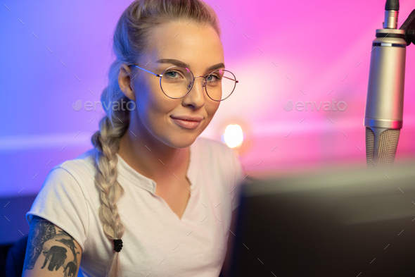 Portrait Of Blonde Gamer Girl With Glasses Playing Online Video Game On Her Computer Stock Photo By Kjekol