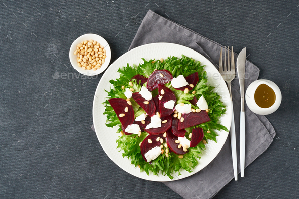 salad with beet, curd, feta, ricotta and pine nuts, lettuce. Healthy keto ketogenic dash diet
