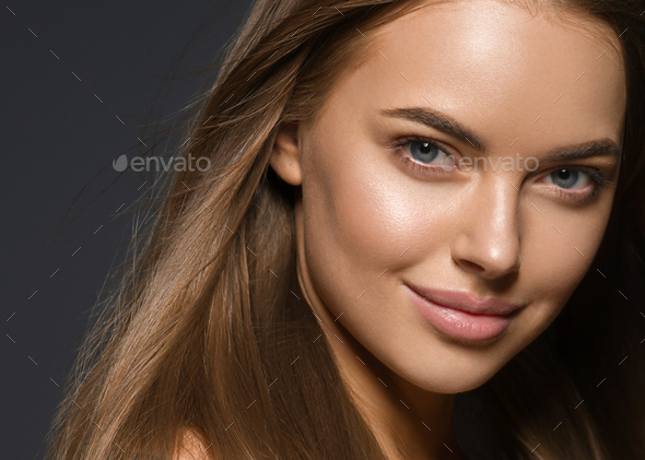 Woman face close up skin tone beautiful eyes smile lips