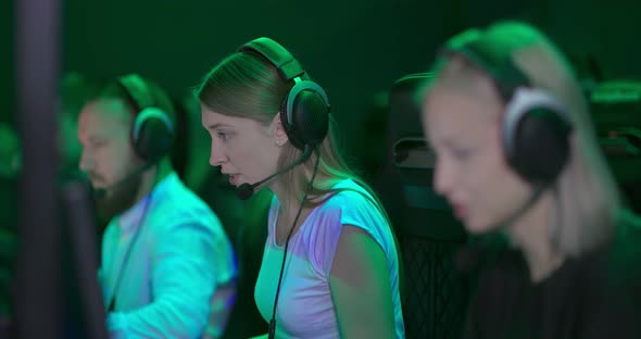 Girls Hotline Operators Work in Front of a Computer in Headphones. Operators Are Sitting in a Row, a alt