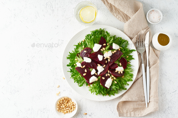 salad with beet, curd, feta, ricotta and pine nuts, lettuce. Healthy keto ketogenic dash diet