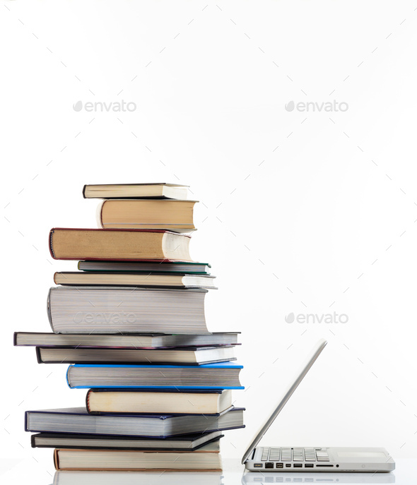 Elearning, books stack and a laptop isolated on white background - Stock Photo - Images