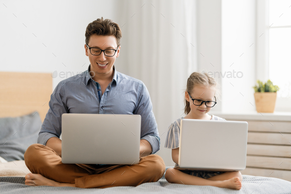father and daughter girl using laptops. - Stock Photo - Images