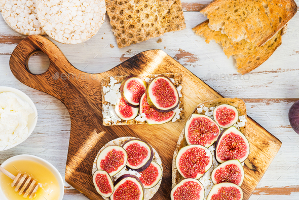 Healthy crackers and toast with figs and ricotta cheese - Stock Photo - Images