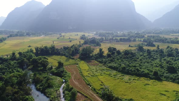 Landscape around the city of Vang Vieng in Laos seen from the sky alt