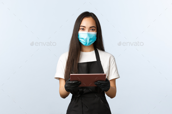 Covid-19, online orders, small coffee shop business and preventing virus concept. Friendly-looking - Stock Photo - Images