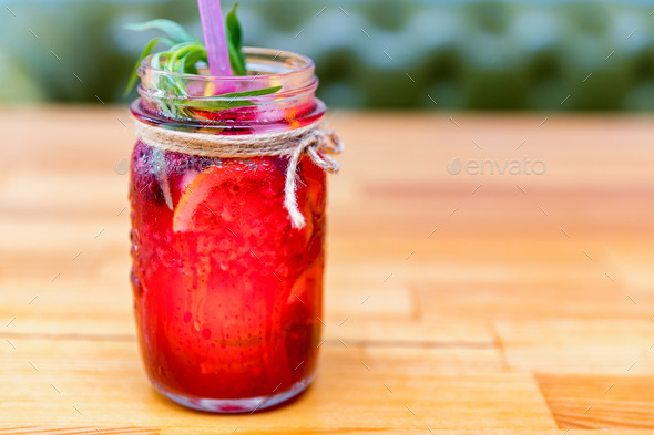 Lemonade or mojito cocktail with lemon and raspberry - Stock Photo - Images