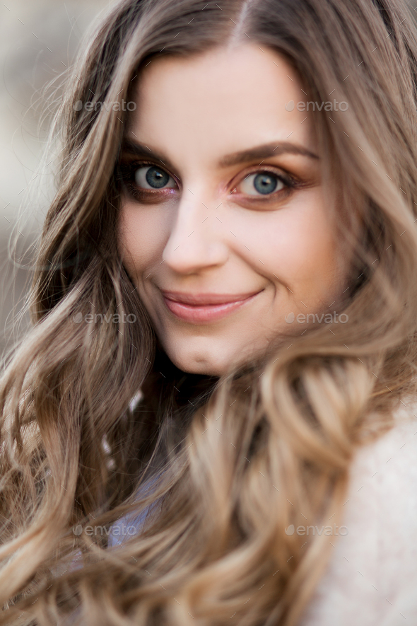 Beautiful girl with wavy hair perfect make up and long eyelashes - Stock Photo - Images