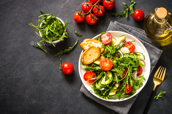 Green salad from leaves and vegetables - Stock Photo - Images