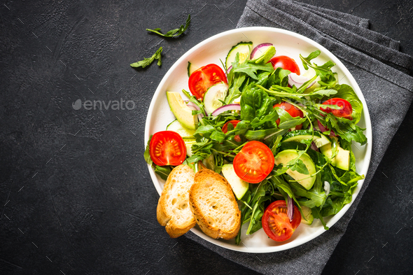 Green salad from leaves and vegetables - Stock Photo - Images