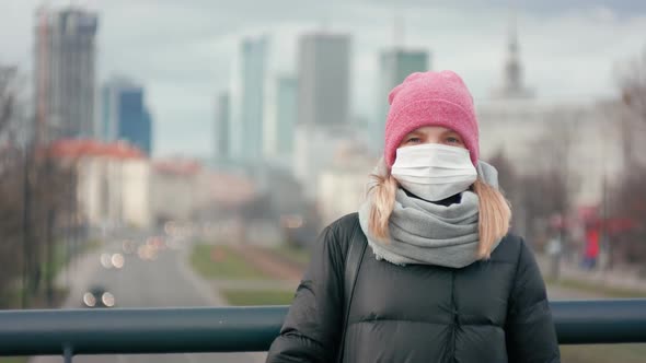 Woman in Surgical Face Mask. COVID-19 Coronavirus Pandemic or Smog Background.