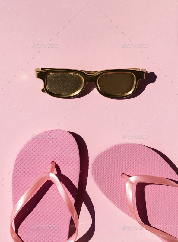 Beach accessories on pink background.Summer vacation. Creative concept.Travel mood to the sea.