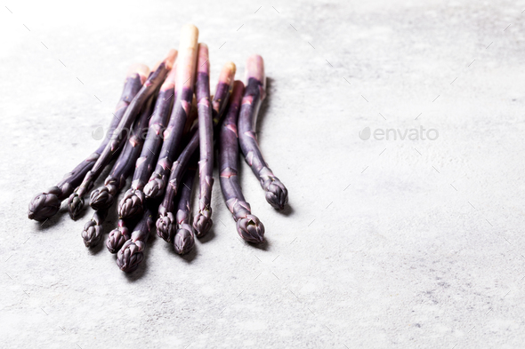 Fresh purple asparagus. Healthy eating concept. Food for vegetarians. - Stock Photo - Images