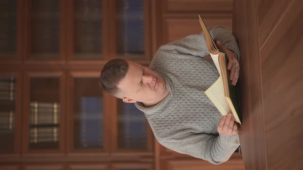 a Man Reading a Book alt