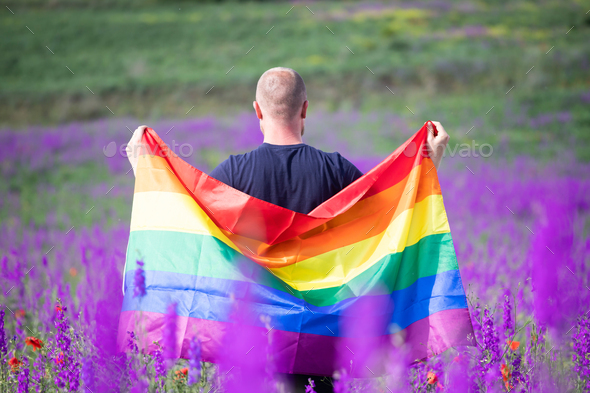 Young man with LGBT flag. - Stock Photo - Images
