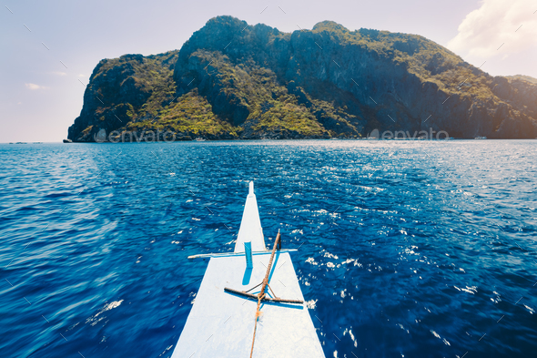 El Nido, Philippines. Front of Island hopping Tour boat hover over open blue ocean water facing - Stock Photo - Images
