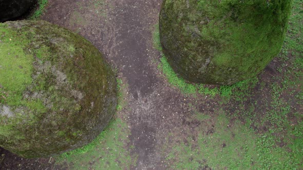 slow drone overflight rocks in the form of huge eggs overgrown with moss Europe park near Vilnius Li alt