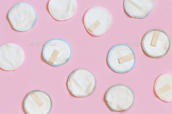 Eco friendly reusable make-up remover pads on pink background