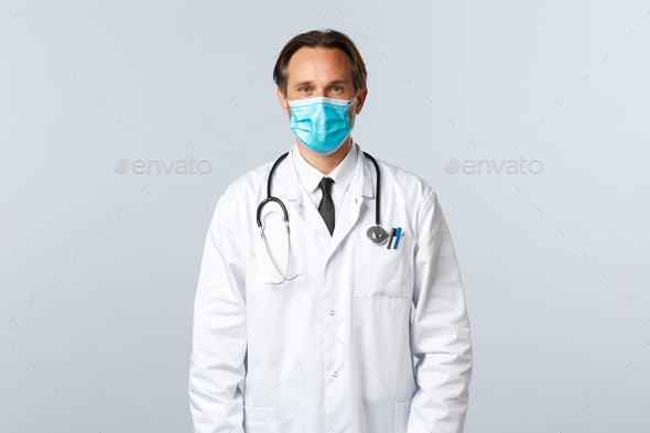 Covid-19, preventing virus, healthcare workers and vaccination concept. Middle-aged professional - Stock Photo - Images