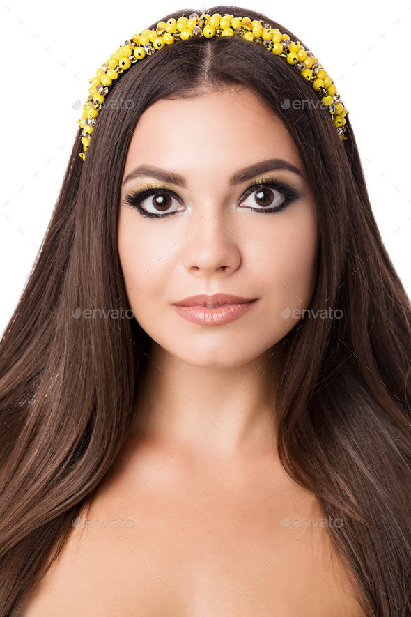 Portrait of beautiful brunette woman with big earring and shinny yellow accessories in hair. Perfect - Stock Photo - Images