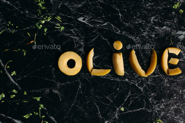 little-letters-of-fruits-at-black-background-in-word-olive-stock-photo-by-studiolucky