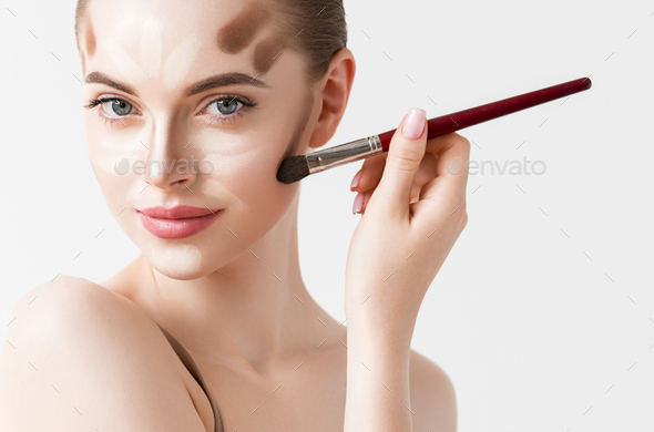 Closeup woman face. Contour Highlight makeup sample. Professional Contouring face white background
