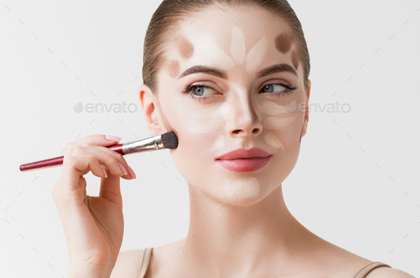 Closeup woman face. Contour Highlight makeup sample. Professional Contouring face white background