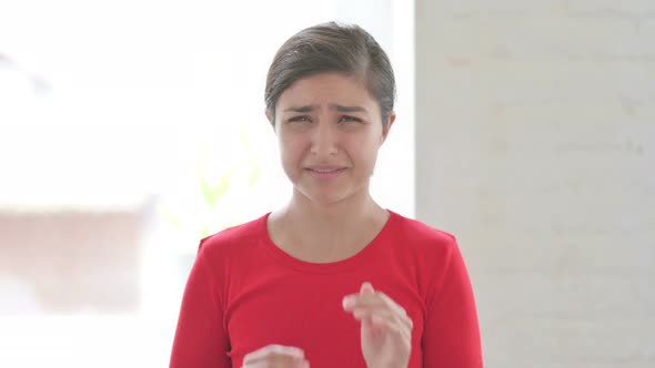 Portrait of Crying Indian Woman Looking with Sad Expression alt