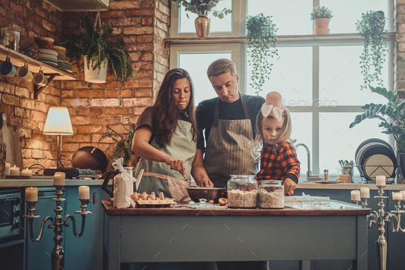 Portrait of small family at the kitchen