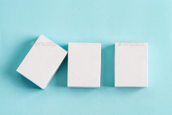 Set from three paper mock up boxes for packaging products and things on a pastel blue background