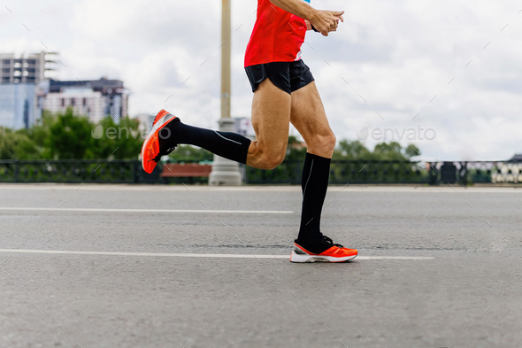 runner in black compression socks