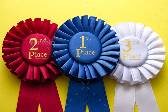 Three rosettes for the winner and runners up - Stock Photo - Images