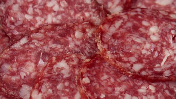 Sliced Raw Smoked Salami Sausage Spun As a Restaurant Backdrop Fresh Cured Sausage for a Sandwich alt