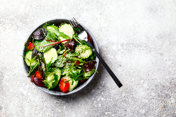 Vegetable salad in a glass bowl with greens.Vegetarian Concept - Stock Photo - Images