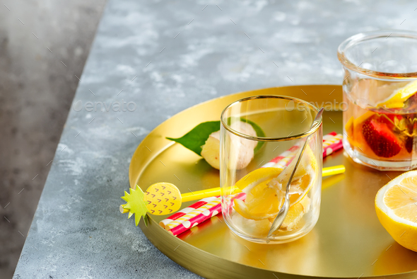 Set from homemade refreshing cold lemonade from berries and lemon fruits in a glasses with plastic - Stock Photo - Images